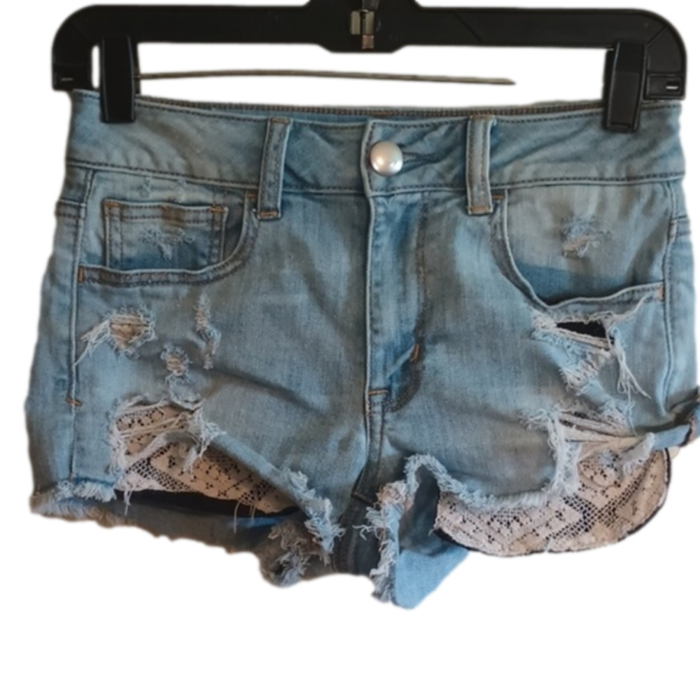 American Eagle Super distressed  hi-rise shortie light wash shorts .Size 2.